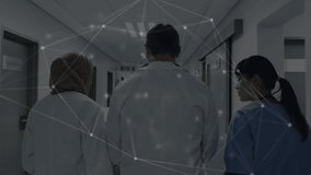 Two doctors and nurse walking hallway raising tablet reviewing data while network overlay drifting. Healthcare, teamwork, technology, professionalism, innovation, medical, hospital - Powered by Shutterstock - Get 15% off with code: PIKWIZARD15