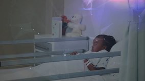 Nurse entering ward touching patient listening heartbeat verifying vitals with stethoscope overlay. Medical, healthcare, pediatric, kindness, compassion, futurism, clinical - Powered by Shutterstock - Get 15% off with code: PIKWIZARD15