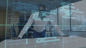 Man placing hands on table activating VR code grid detecting malware while colleague observing. Technology, cybersecurity, innovation, digital, corporate, data, futuristic - Powered by Shutterstock - Get 15% off with code: PIKWIZARD15