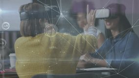 Technology team putting on VR headsets and exploring data network diagrams with colleague observing. Innovation, collaboration, futuristic, digital, immersive, enterprise, interaction - Powered by Shutterstock - Get 15% off with code: PIKWIZARD15