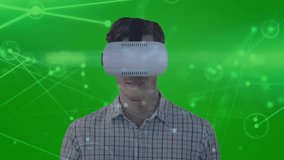 White adult male wearing VR headset tapping and swiping network nodes configuring virtual network. Virtual reality, digital interface, technology, futuristic, innovation, data visualization, immersive - Powered by Shutterstock - Get 15% off with code: PIKWIZARD15