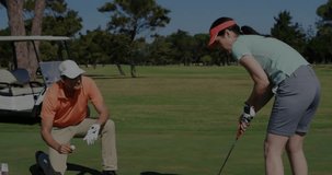 golf instructor kneeling pointing toward hole starting grid with percentages guiding student putt. Sports, coaching, analysis, technology, precision, strategy, training - Powered by Shutterstock - Get 15% off with code: PIKWIZARD15