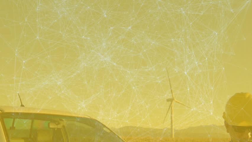 Male worker powering tablet on at wind farm tapping animated overlays checking turbine performance. Renewable energy, industrial, rural, technology, maintenance, sustainable, outdoor - Powered by Shutterstock - Get 15% off with code: PIKWIZARD15