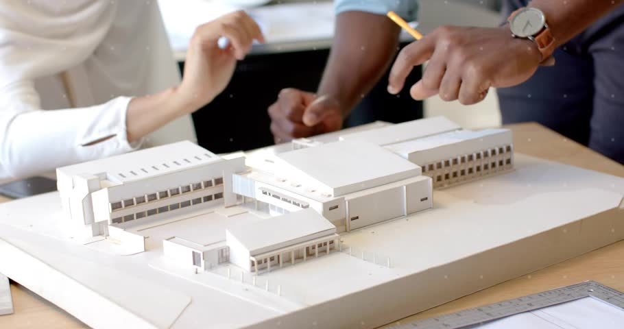 Architects tapping model activating cycling currency icons for finance comparison. Urban, collaboration, innovation, drafting, technology, planning, brainstorming