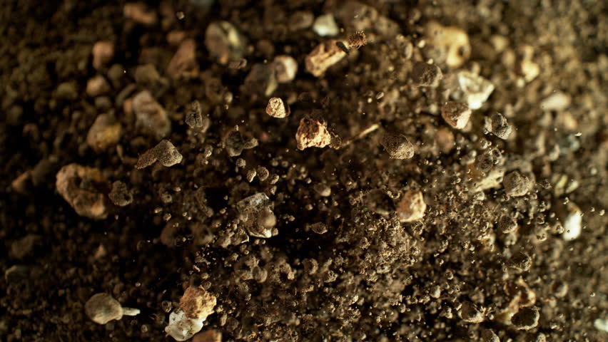 Super Slow Motion Shot of Exploding Soil with Rocks Towards Camera at 1000fps.