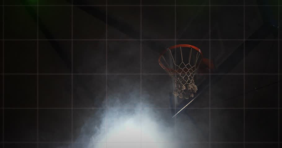 Laser beams tracing sports grid igniting fog while athlete rising and slamming dunk through net. Kinetic, futuristic, illuminated, dynamic, performance, athleticism, technology