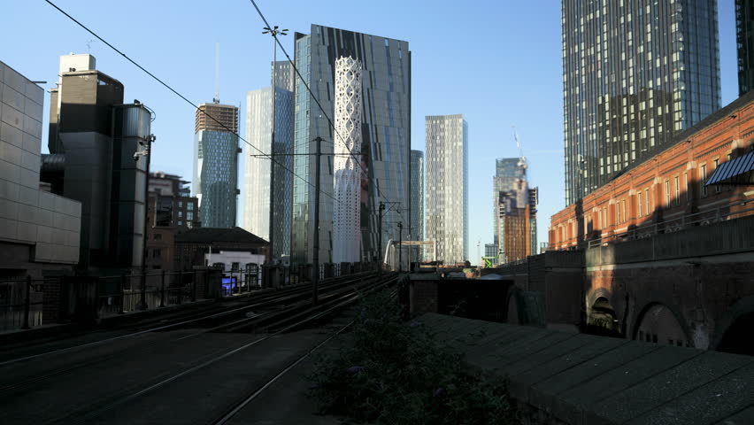 4K: Timelapse of Metro Trams in Manchester, England, UK. Skyscrapers behind. Stock Video Clip Footage