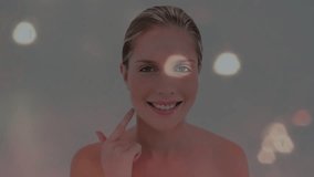 Female model touching cheek and neck, activating glowing orbs visualizing beauty technology effect. Digital, futuristic, minimalism, beauty, technology, lighting, skincare - Powered by Shutterstock - Get 15% off with code: PIKWIZARD15