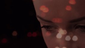 Woman gazing downward and blinking while bokeh drifting and code flickering for technology demo. Futuristic, abstract, technology, innovation, motion, visualization, digital - Powered by Shutterstock - Get 15% off with code: PIKWIZARD15