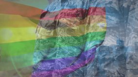 Camera panning revealing three USAF airmen standing under waving rainbow flag showing support. Military, unity, diversity, pride, ceremony, teamwork, discipline - Powered by Shutterstock - Get 15% off with code: PIKWIZARD15