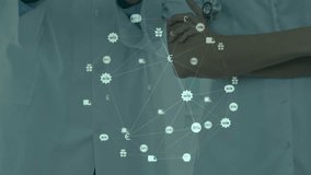 Female doctor swiping tablet while male colleague adjusting device, animating medical network icons. Medical, collaboration, technology, innovation, healthcare, professionalism, digital - Powered by Shutterstock - Get 15% off with code: PIKWIZARD15