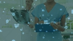 Upon doctor examining X-ray for billing, nurse writing notes while icons floating before fading. Medical, teamwork, professional, healthcare, collaboration, diagnostic, consultation - Powered by Shutterstock - Get 15% off with code: PIKWIZARD15
