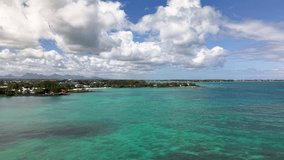 Mauritius North Coastal Splendor: A Sweeping Vista of Turquoise Lagoons, White Sand Beaches, and Green Vegetation Against a Backdrop of Majestic Clouds and Volcanic Peaks. Ultimate Island Dream. - Powered by Shutterstock - Get 15% off with code: PIKWIZARD15