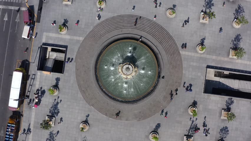 DRONE: TOP DOW ROTATING VIEW OF THE MAIN FOUNTAIN IN FRONT OF THE CATHEDRAL IN GUADALAJARA, JALISCO