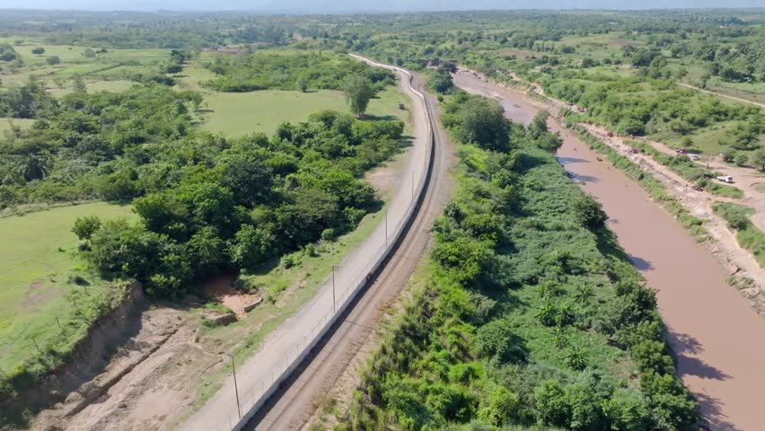 View of Border fence between the Dominican Republic and Haiti from the Dajabon area, Dominican Republic