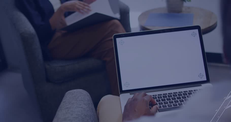 Colleagues collaborating in lounge with tech interface fading in and sweeping timeline to year 2013. Technology, innovation, collaboration, digital, workspace, modern, communication