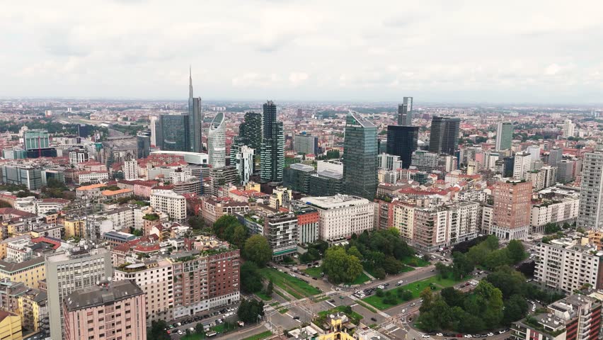 Fly towards skyscrapers in Milan, Italy