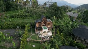 Discover an elegant bamboo villa retreat in Bali where sustainable design meets luxury. Enjoy the infinity pool, scenic landscapes, and tranquil ambiance for the perfect tropical getaway. - Powered by Shutterstock - Get 15% off with code: PIKWIZARD15