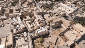 Drone aerial view of rooftop terrace cafes in Midyat old town, popular dining and tourism spot in Mardin Province, showcasing historic stone houses and social culture. - Powered by Shutterstock - Get 15% off with code: PIKWIZARD15