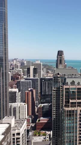 Vertical Drone Shot of Chicago USA Downtown and Lakefront Towers and Buildings on Sunny Day, Illinois USA