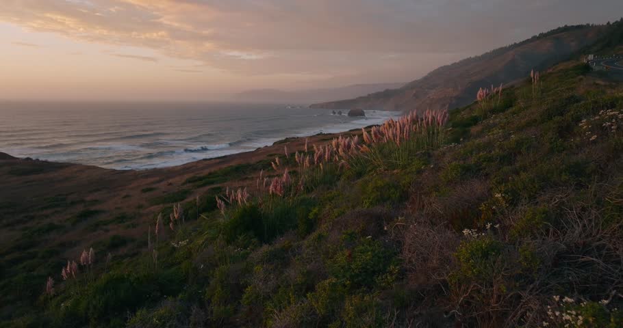 Serene California coast at sunset, peaceful ocean view in warm light