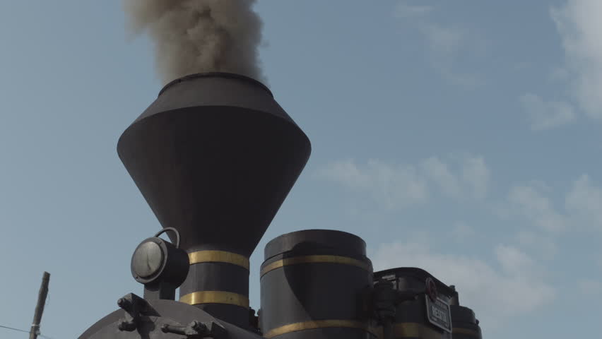Working chimney of a steam locomotive working.