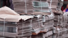 Stacks of newspapers on London sidewalks showing everyday news and urban life.
 - Powered by Shutterstock - Get 15% off with code: PIKWIZARD15