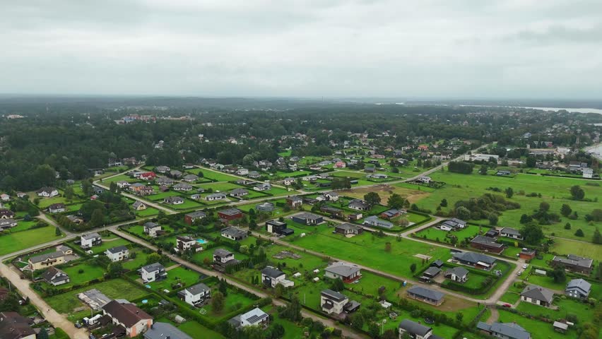 Aerial view of Ikskile town with green landscapes, calm mood