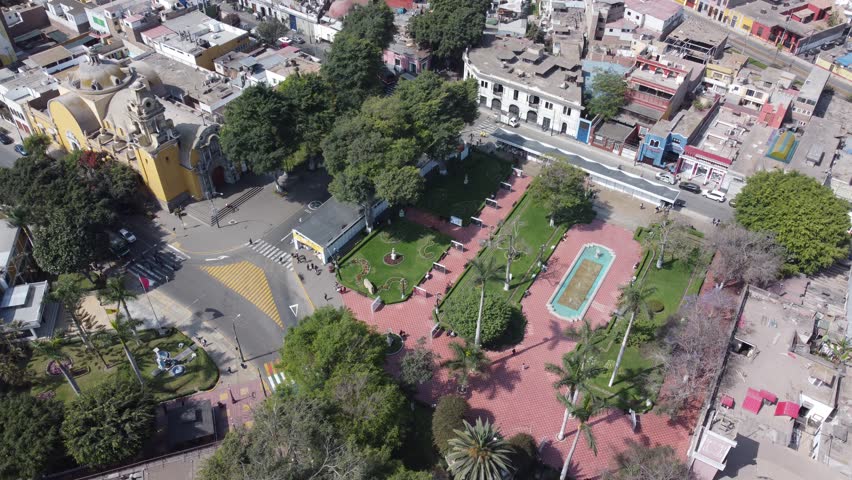 Aerial top down view of the main square in the barranco district, lima, with its historic church