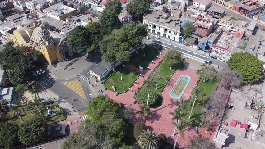 Top down drone view of the central park and historic church in barranco, a district of lima, peru