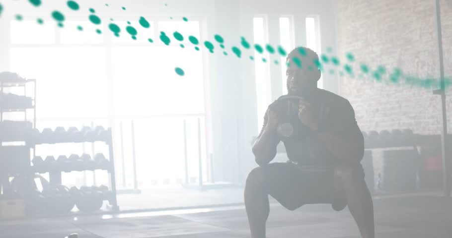 Man gripping kettlebell and lowering into goblet squat while green fitness metrics tracking motion. Strength, fitness, data visualization, performance, athleticism, digital interface, wellness