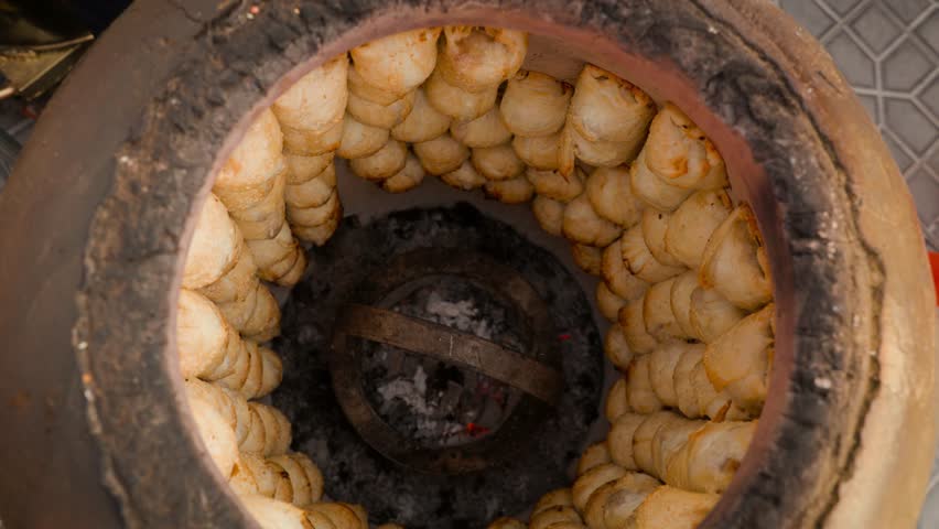 Samsa is baked in a tandoor oven