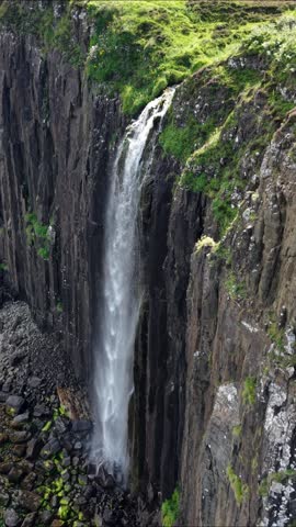 Discover the breathtaking beauty of a waterfall on the Isle of Skye in Scotland from the sky
