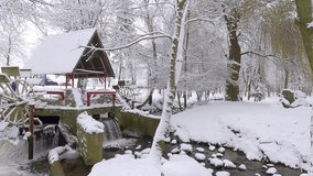 Old water mill in Topilche park in Ternopil city, Ukraine, Europe. Stunning winter scene of the shore of Strypa river. Snowy morning view of city park. 4K video (Ultra High Definition). - Powered by Shutterstock - Get 15% off with code: PIKWIZARD15