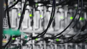 Rows of active server racks in a modern data center, with glowing green LEDs and tangled network cables against a dark background. A powerful visual representation of cloud computing - Powered by Shutterstock - Get 15% off with code: PIKWIZARD15