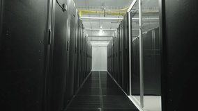 A long, symmetrical aisle in a modern data center, lined with rows of black server racks and illuminated by cool blue and green LEDs. A clean, futuristic view of the high-tech infrastructure powering  - Powered by Shutterstock - Get 15% off with code: PIKWIZARD15