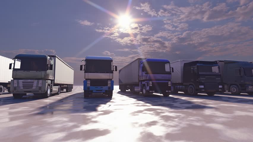 Semi-trucks parked in a row at sunset. A line of modern commercial trucks in different colors at sunset for a logistics, transportation, or shipping company advertisement.