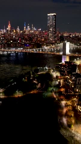 Night View Of Brooklyn Bridge At Manhattan In New York United States. City At Night Scene. Illuminated Bridge Landscape. Brooklyn Bridge At New York United States. Iconic Bridge.