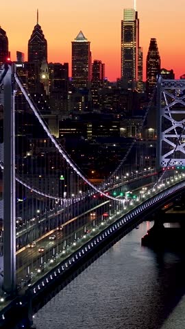 Sunset Skyline In Benjamin Franklin Bridge At Philadelphia In Pennsylvania United States. Highrise Buildings Landscape. Colorful Sunset. Philadelphia At Pennsylvania United States.