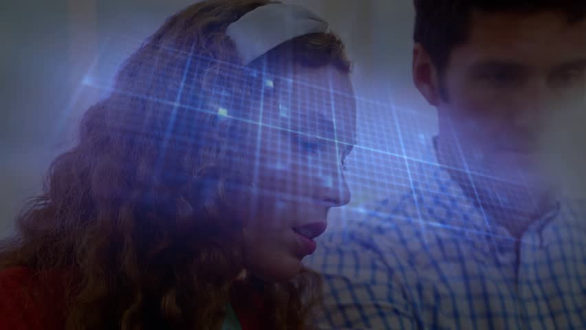 Coworkers leaning as holographic display projecting blue grid, analyzing metrics for business plan. Collaboration, innovation, technology, data visualization, professionalism, futuristic, focus - Powered by Shutterstock - Get 15% off with code: PIKWIZARD15