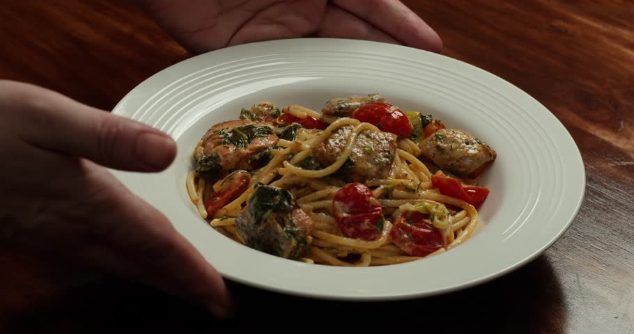 Spaghetti Carbonara Served with Pancetta on a Plate - Presentation of the Main Course in a Sunny Italian Restaurant, Packshot, Dolly out