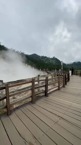Smoke rises from the Sikidang crater in Dieng.