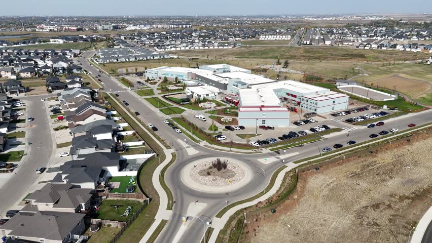 Aerial view of Rosewood in Saskatoon, highlighting modern homes, parks, and schools in this southeast community in crisp 4K.