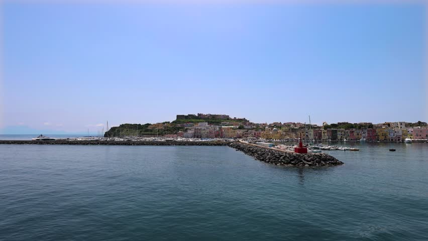 Italy, Procida Island shoreline with shops and colorful old city buildings facing the sea