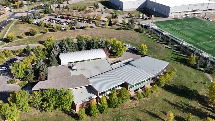 Aerial view of University Heights Saskatoon highlighting schools, recreation areas, and community spaces in 4K.