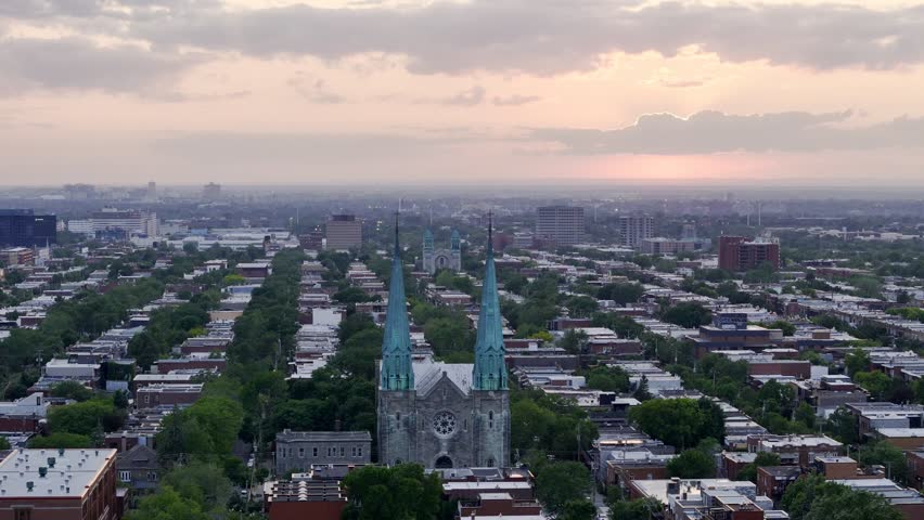 Sunset aerial view of church spires over Montreal cityscape. g.