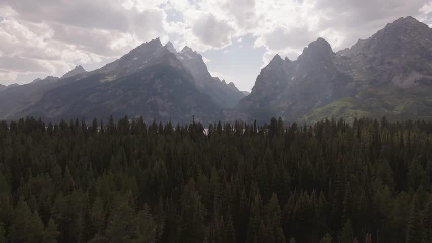 Drone shot revealing the Teton mountains in Montana at sunset