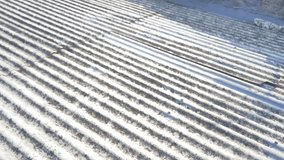 Close-up view of an old corrugated metal roof with visible weathering, rust, and sunlight casting strong shadows across the textured surface. - Powered by Shutterstock - Get 15% off with code: PIKWIZARD15