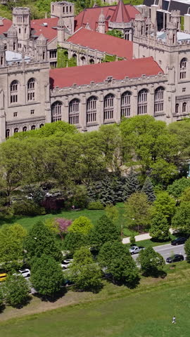 University of Chicago, Illinois USA, Vertical Drone Shot of Campus Buildings, Halls and Towers on Sunny Day