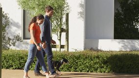 Couple walking dog on path initiating floating social media notifications increasing around them. Romantic, digital, communication, outdoor, connection, lifestyle, modern - Powered by Shutterstock - Get 15% off with code: PIKWIZARD15